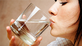 Lady drinking a glass of water 