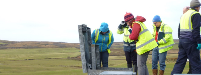 Staff looking down an open hatch